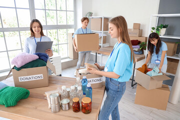 Young volunteers with donations for poor people in center