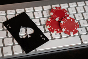 Keyboard, ace of spades and poker chips