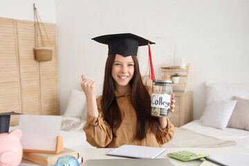 Young woman with graduation hat and savings for education at home