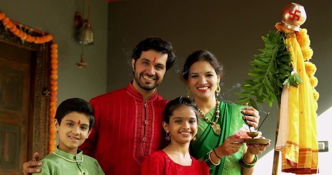 Portrait of Happy Indian Family in Traditional Attire Smiling After Gudi Padwa Puja Outdoors, Celebrating Hindu New Year with Kids