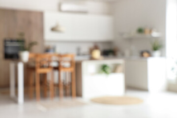 Stylish interior of room with kitchen table. Blurred view