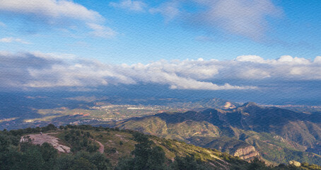 Fototapeta premium Mountain range with a city in the distance