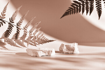A stone podium on a beige background with beautiful shadows. The demonstration of the colors of...
