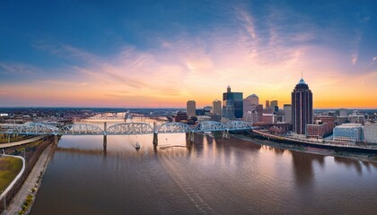 Fototapeta premium Louisville's Skyline and Bridge Bathed in Morning Light: Aerial View