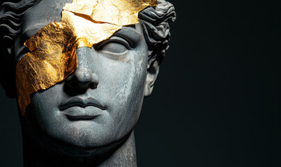 Classical Bust with Gold Leaf Accents on Dark Background