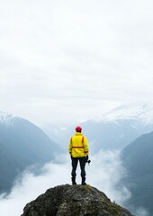 Obraz premium Rescue Volunteer Overlooks Misty Mountain Valley for Missing Persons