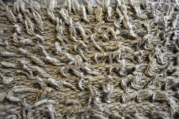 Women's clothing, stylish knitwear made of natural woolen dense threads. Beautiful patterns, braids, nice, soft braided woolen fabric.