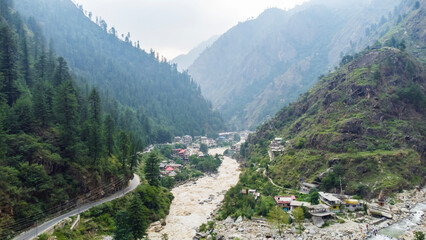 Aerial view of himalayan mountains at kasol himachal pradesh. Small villages and colorful local houses nested in the hills of parvati valley at kasol, himachal pradesh, India.