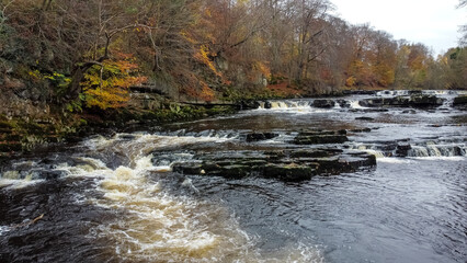 Aerial view of cascades on River Ure in Autumn