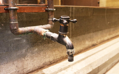 Iron faucet industrial style background.