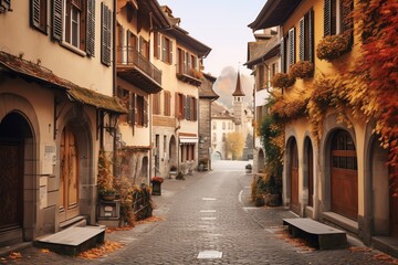 Fototapeta premium Picturesque autumnal cobblestone street in a charming European village.