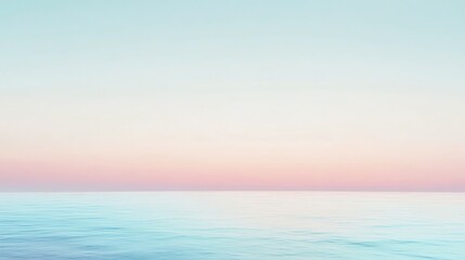 Fototapeta premium A soft, pastel sunset over a calm sea.