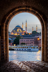 Istanbul city view with a mosque from an old stone door.