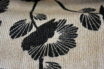 Knitwear, women's clothing, cotton products, unusual fabric backgrounds. Beige fabric, finely weaved, dyed with large black flowers with leaves on a background of small gathering, elastic.