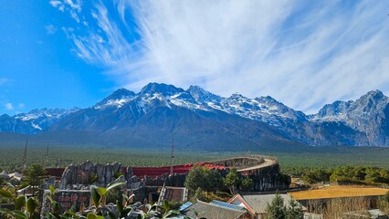 Jade Dragon Snow Mountain Range with Scenic Valley and Rustic Structures, Lijiang, China