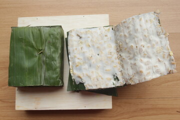 raw tempeh on wooden table