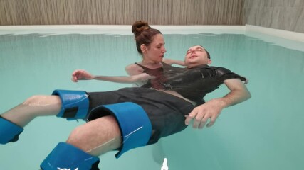 Aquatic therapy session highlights relaxation and rehabilitation in therapeutic pool.