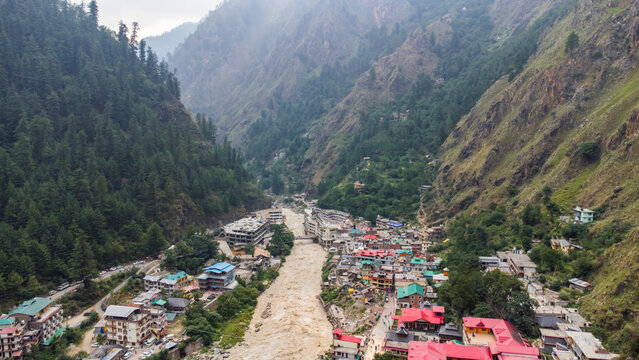 Aerial view of manikaran town with the parvati river and local houses in the parvati valley at himachal pradesh state of India.