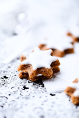 Christmas cookies (cinnamon stars) on bright background. Close up.

