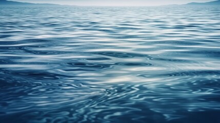 Naklejka premium Calm Blue Water Surface With Gentle Ripples Under Soft Light