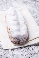 Christmas strudel with marzipan on bright background. Close up.