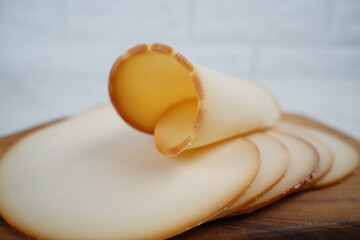 Smoked cheese. Dutch sliced cheese