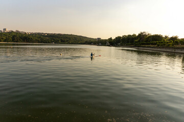 A small lake where kayaks are paddling