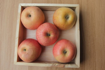 apples in a wooden bowl
