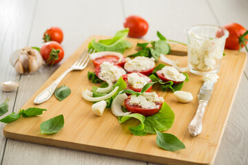 tomato wedges with cottage cheese filling and garlic, spicy appetizer