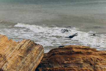 Early morning sunrise over the sea . Some clouds.