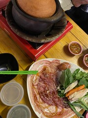 A dish in Thailand called Dip Dip has a clay pot with soup for poaching pork and vegetables.