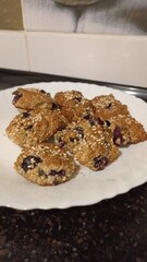oatmeal cookies with raisins on a white plate. homemade sweet pastries.Mobile photo