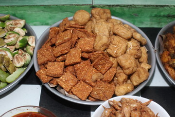 fried tofu and tempeh in a tray, Perfect for recipe, article, catalog, or any commercial purposes.