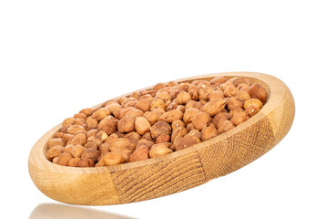 Several hazelnuts with wooden bowl, close-up, isolated on white background.