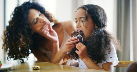 Mother, girl and happy with feeding cupcake at home for bonding, care and support. People, family...