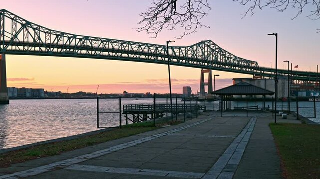 View of one of the most iconic landmarks of Boston, the Tobin bridge at sunrise spanning over the Mystic river.