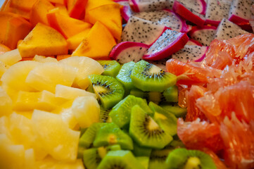 Tropical food. Exotic fruit. Exotic summer fruits of pineapple, pitaya pitahaya, diospyros,...