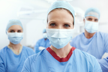 People, mask or surgeon in portrait for safety, emergency accident or leadership in hospital theater. Teamwork, woman or doctor in surgical gear in operating room for medical health or operation help