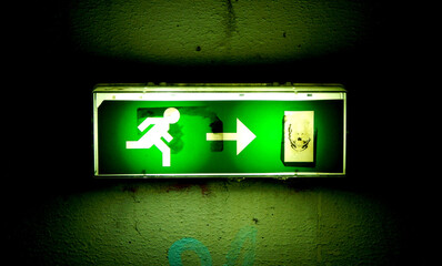 Green Exit Light in the Street of Paris