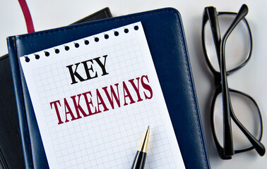 KEY TAKEAWAYS - words on white sheet on light background with notebook and cactus