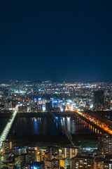 Fototapeta premium Two Osaka Bridges Illuminated at Night from Umeda Sky Building Observatory Deck