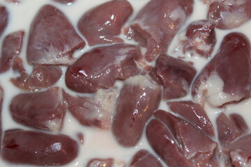 Raw chicken hearts in milk