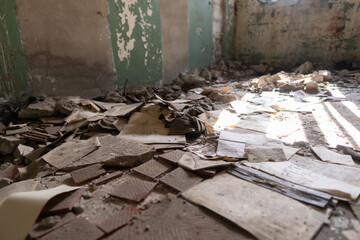 Abandoned Ruins of a Derelict Space with Scattered Papers and Debris