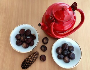 Shiny brown chestnuts on the table