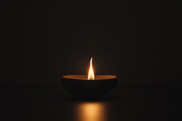 A small fire burning in the darkness, against a black background, captured in high-definition photography