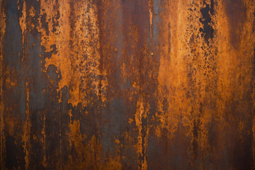 Fototapeta premium rusted metal sheet with deep orange and brown tones forming abstract patterns