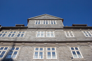Fototapeta premium Front facade with grey tiles on a historic house in Wolfenbuttel, Germany
