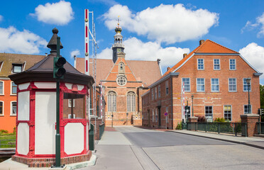 Obraz premium Bridge house and historic new church in Emden, Germany