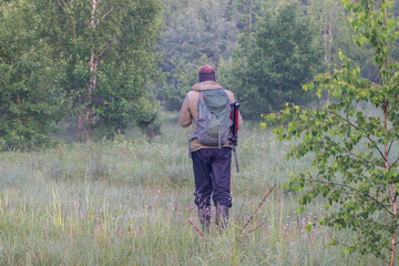 walking man in the foggy forest