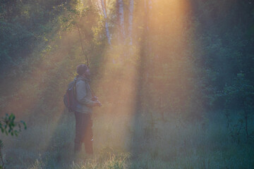 person in the foggy forest